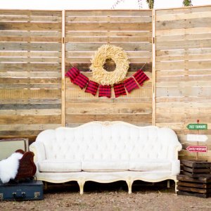 Moody Bohemian Styled Shoot trifold backdrop Belle couch crates suitcases